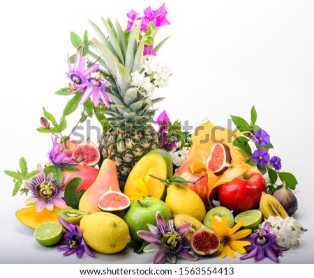 Enjoy your healthy breakfast: collection of various fruits with passion flowers on white background