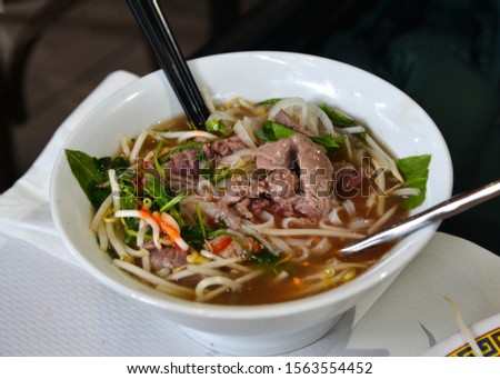 Traditional Vietnamese noodle soups (pho bo) with beef meat and vegetable.