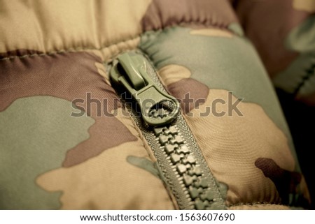 jacket camouflage with lock close up                              
