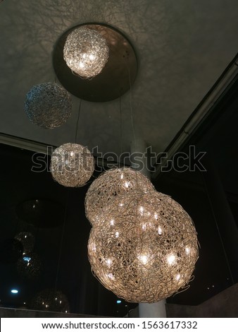 Beautiful wireframe ball led lighting decorations hanging from a ceiling