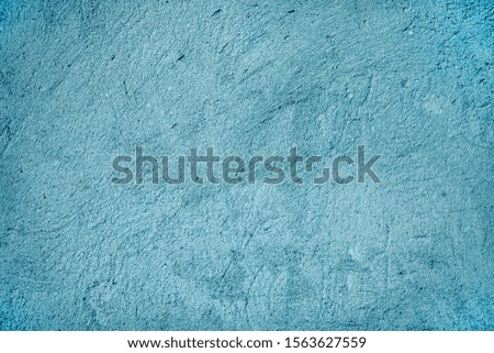 Background - grain texture blue paint wall. Beautiful abstract grunge decorative navy blue dark wallpaper. Cement wall texture in blue color.