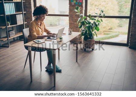 Full size photo of cool smart afro american girl real estate agent work computer type start-up presentation sit table in office loft