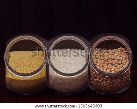 Full frame shot of three pots of cereal. Couscous, rice and chickpeas