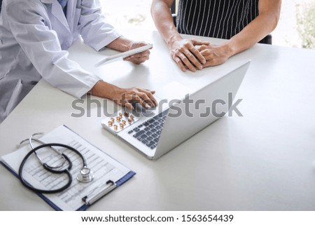 Doctor consulting patient discussing something symptom of disease and recommend treatment methods, presenting results on report and prescription, Medicine and health care concept.