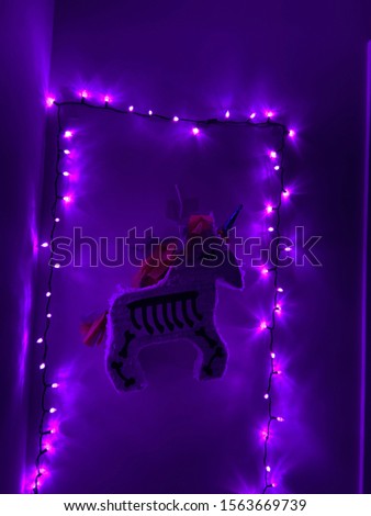piñata surrounded by purple lights 
