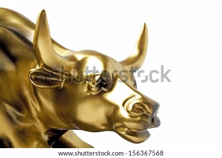 Bull - a gold statue close-up on a white background