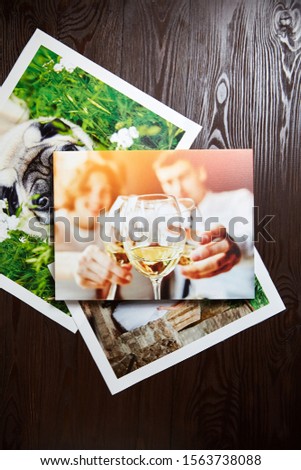 Wedding photo printed on canvas. Sample of stretched photography. Canvas prints on brown wooden background, top view