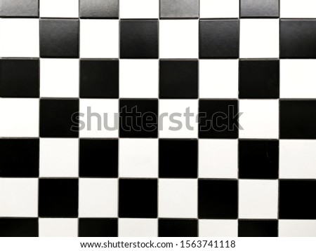 Close up surface of black and white square tiles