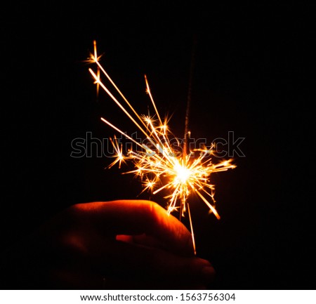 christmas sparklers over dark background