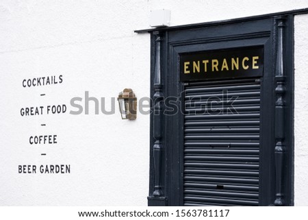 Restaurant and pub black entrance door and food cocktails coffee beer garden sign