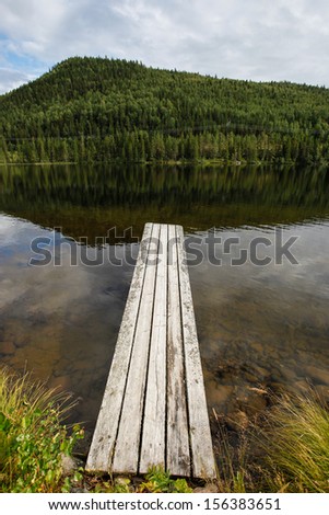 wooden dock by swedish lake 
