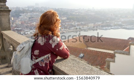 Cute girl enjoys the sun over the city of Porto - travel photography