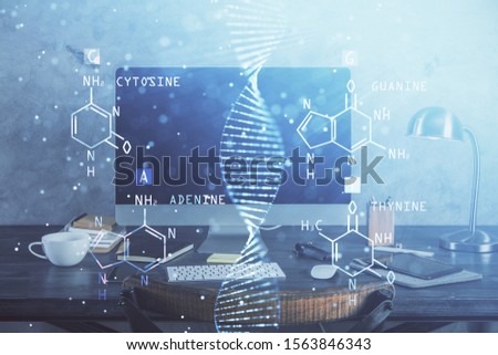 Desktop computer background and DNA drawing. Double exposure. Science concept.