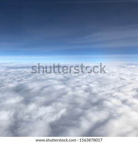 A picture of clouds from a plane over the East Coast of the United States.