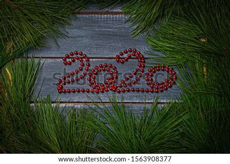 Christmas flat barking numbers 2020 made of red garland decorated with cedar branches with New Year's red balls of different colors. Mock up for Santa Claus letter and Christmas designs