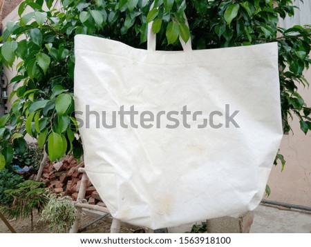 White Eco Friendly Bag hang with plant, Non Woven Bag, Polypropylene Reusable shopping and Gift Bag 