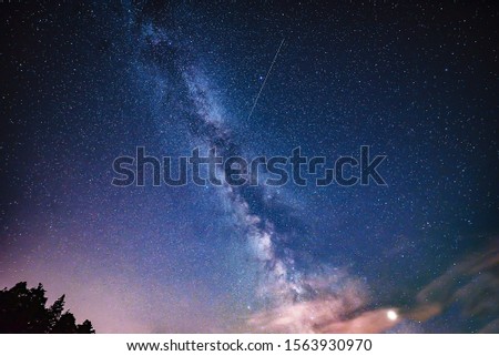 Milky Way, Jupiter Planet and shooting stars/meteorites in the night sky.
