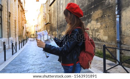 Selective focus of Woman tourist look searching direction on location map in the city