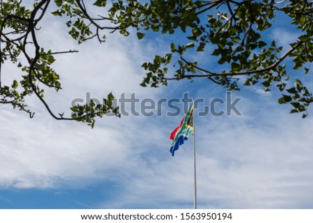 South African national flag against blue sky