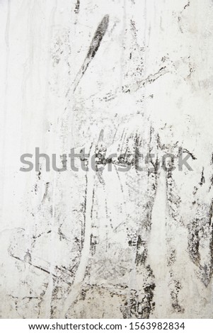 Black texture on old white wall Royalty-Free Stock Photo #1563982834