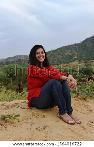 Outdoor Shot Of Young Beautiful Woman with smiling face