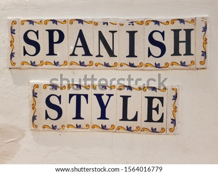 Nice wall spanish style sign made from small ceramic bricks in narrow streets of Marbella - Andalusia Spain