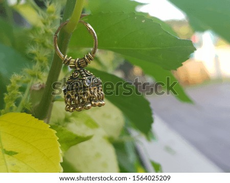 Pair of gold colour metal earring