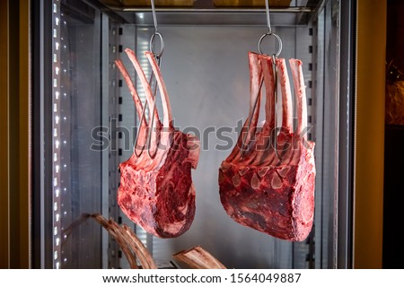 Marbled beef dry aging lies in the refrigerator Royalty-Free Stock Photo #1564049887