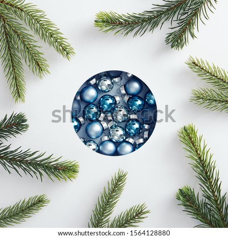 Christmas minimal concept - creative abstract christmas bauble made of xmas balls and tree branch. Xmas background. Christmas holiday pattern. Winter holiday symbol.