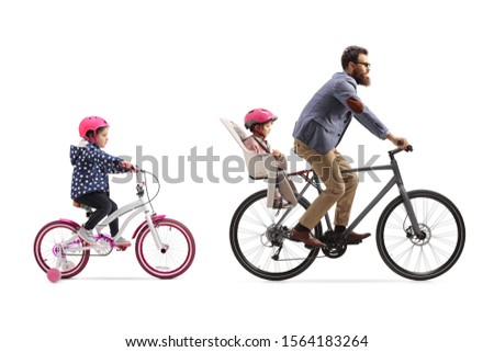 Father riding a bicycle with a child seat and a little girl riding a bicycle behind isolated on white background