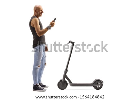 Full length profile shot of a bald male hipster renting a scooter with a mobile phone application isolated on white background