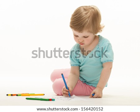 Child drawing a picture with colorful felt-tip pens; white background