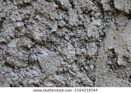 Facade plaster background. Single-ply monolithic plaster decorative background. Single layer scraped cement plaster wallpaper. Exterior building structure backdrop. Silica sand Cement Wall Plaster.