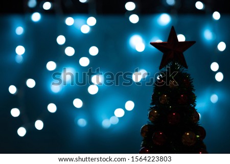 Silhouette of Christmas tree with lights. Minimal Christmas or New Year concept.