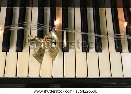 Piano with Christmas decor, closeup