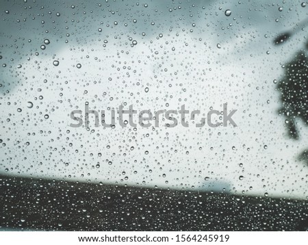 rains water drops on car window. background and texture concept.