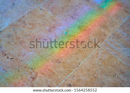                          Blurred texture of the rainbow on the granite floor as a background.     
