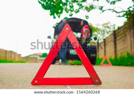Triangle caution sign on the road