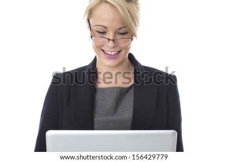 Model Released.  Young Business Woman Using a Laptop Computer