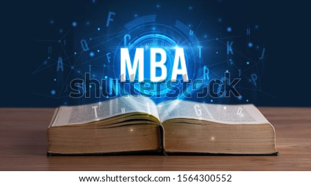 MBA inscription coming out from an open book, digital technology concept