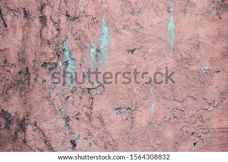 Shattered plaster on cement gypsum painted wall. Flaked exterior city facade. Coarse grunge, worn blocks background. Uneven spooky surface of stone structure. Retro red sandstone texture for 3d design