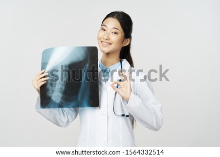 x-ray young woman doctor medical gown positive gesture