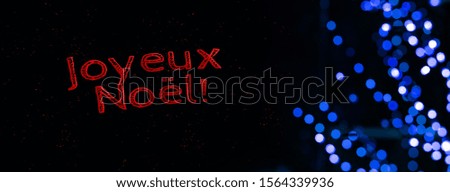 "Merry Christmas" text French language winter holidays black background wallpaper poster picture with blue garland illumination 