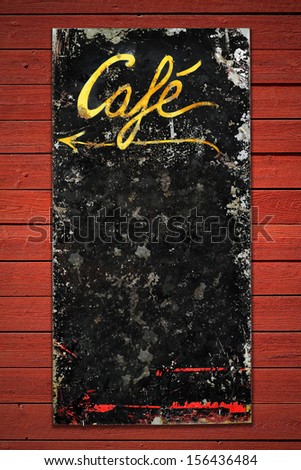 Old coffee sign in weathered metall on a red vintage wall, space for own text