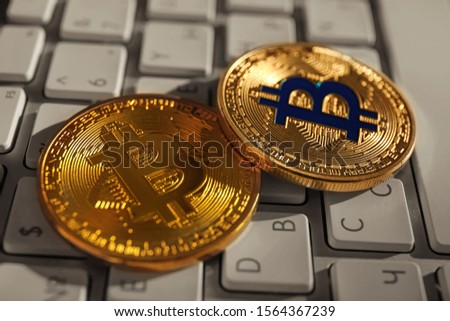 Golden bitcoins on PC keyboard