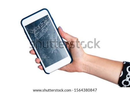 Woman hands holding smartphone with cracked screen isolated on white
