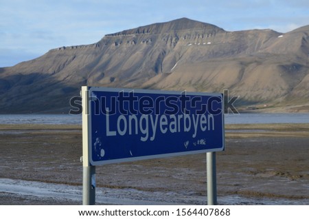Road sign saying Longyearbyen -  a small coal-mining town on Spitsbergen Island, in Norway's Svalbard archipelago.