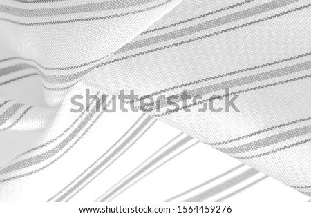 embossed drawing, composite textiles, dense silk fabric of white color, gray lines, stroke on fabric, narrow strip. feature, line, stroke, dash, trace,