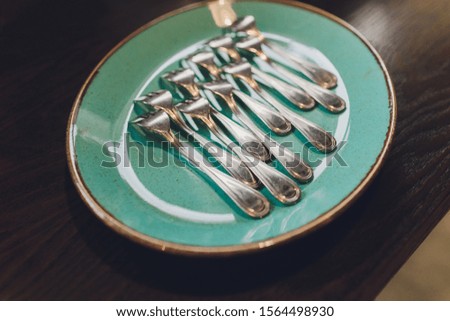 spoons, chopsticks, and plates set in buffet.