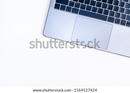 a laptop on white table